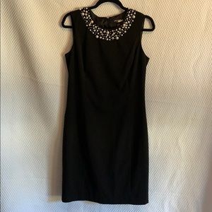 Black dress with pearl neckline detail. Size 8.